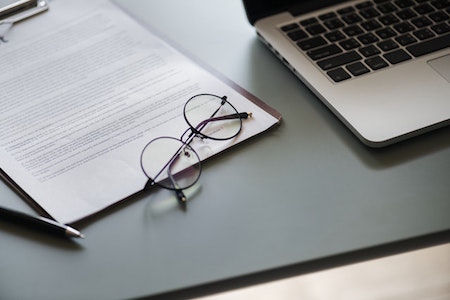 desk-computer-paper-glasses-pen